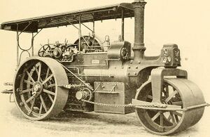 A sepia photograph of a vintage steamroller from 1902